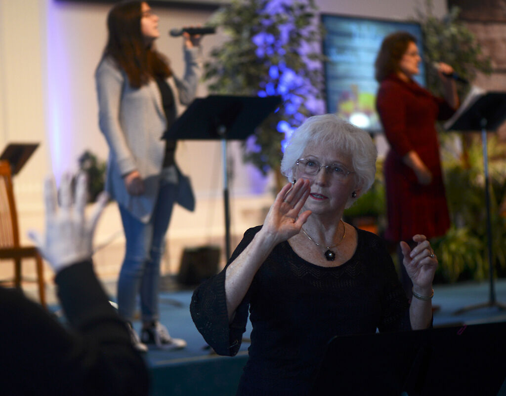 Eunice Morrow signs one of the worship songs during a church service